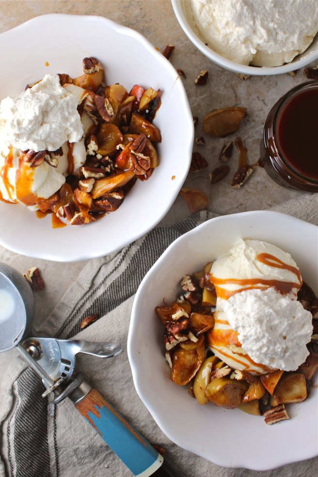 These Caramel Baked Apple Ice Cream Sundaes are loaded with brown sugar and cinnamon baked apples and homemade salted caramel sauce! | The Millennial Cook #fallrecipe #icecream #sundae #apple #caramel