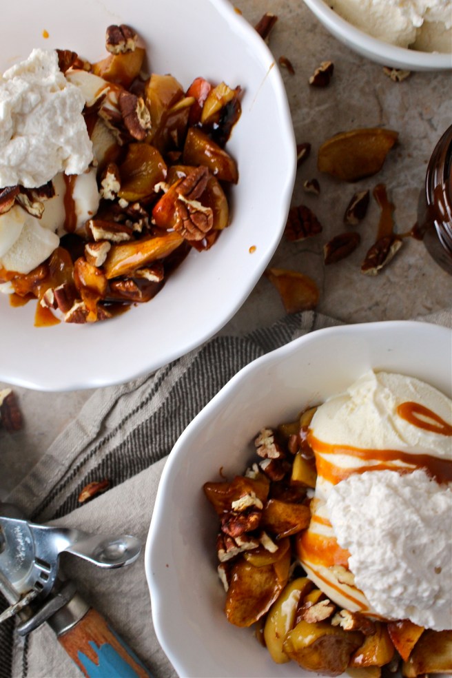These Caramel Baked Apple Ice Cream Sundaes are loaded with brown sugar and cinnamon baked apples and homemade salted caramel sauce! | The Millennial Cook #fallrecipe #icecream #sundae #apple #caramel