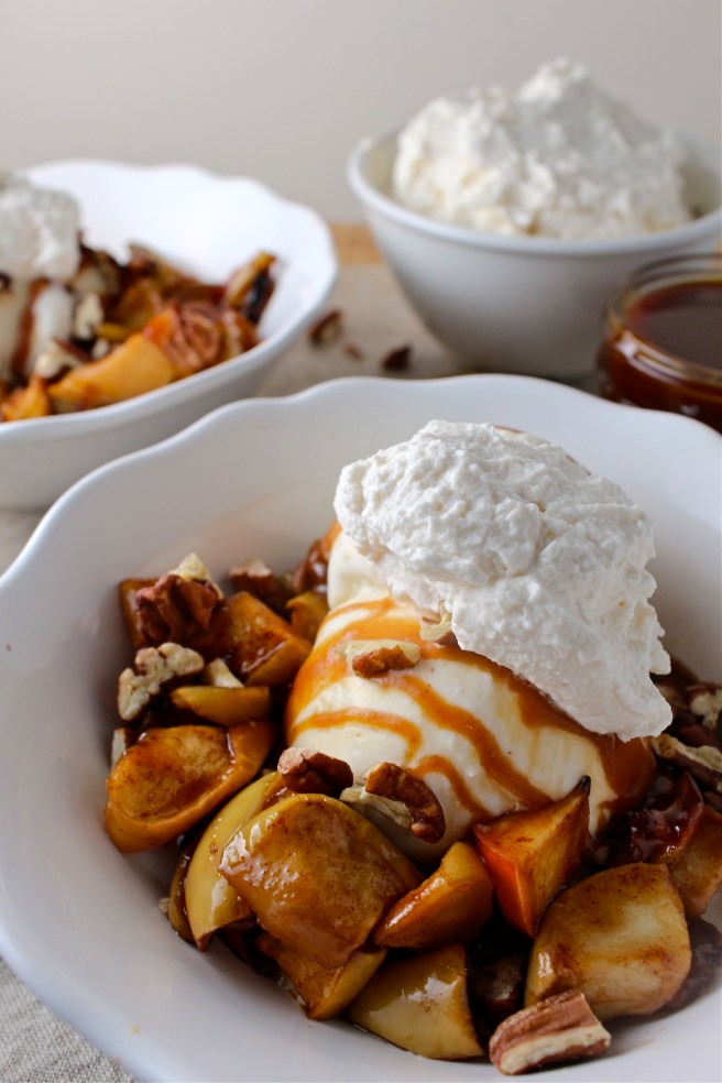 These Caramel Baked Apple Ice Cream Sundaes are loaded with brown sugar and cinnamon baked apples and homemade salted caramel sauce! | The Millennial Cook #fallrecipe #icecream #sundae #apple #caramel