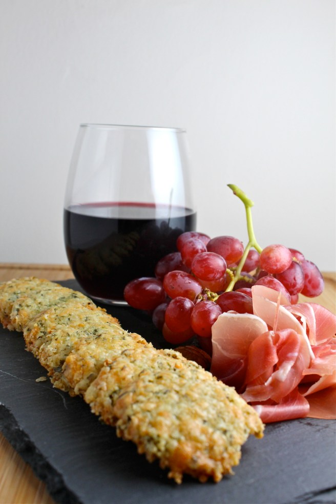 These rich, flaky, and extra cheesy Cheddar Herb Crackers are the perfect snack to pair with red wine! | The Millennial Cook #appetizer #cheeseplate #crackers #cheddar