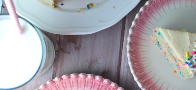 This Funfetti Cake is swathed in a delicious vanilla buttercream frosting and loaded with sprinkles for the perfect celebratory treat! | The Millennial Cook #cake #funfetticake #birthdaycake #sprinkles