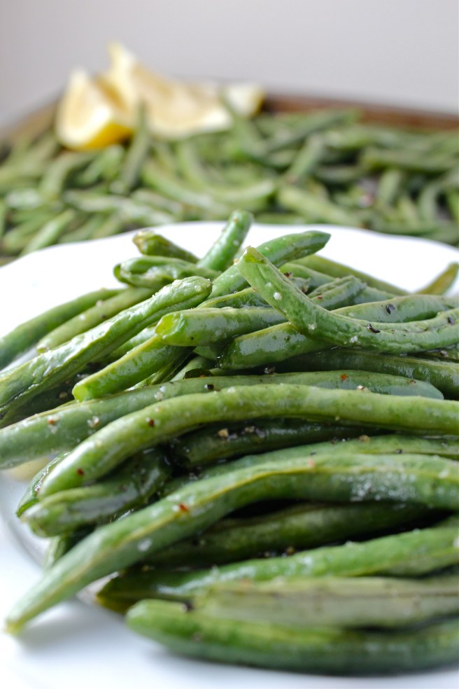 These Roasted Green Beans are dressed with olive oil and lemon juice for the easiest and most delicious side dish! | The Millennial Cook #greenbeans