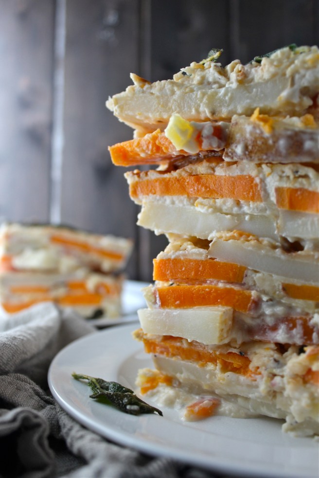 These Scalloped Potatoes are loaded with cheddar cheese and an amazingly rich and creamy sauce! | The Millennial Cook #winterrecipe #potatoes #scallopedpotatoes #sidedish