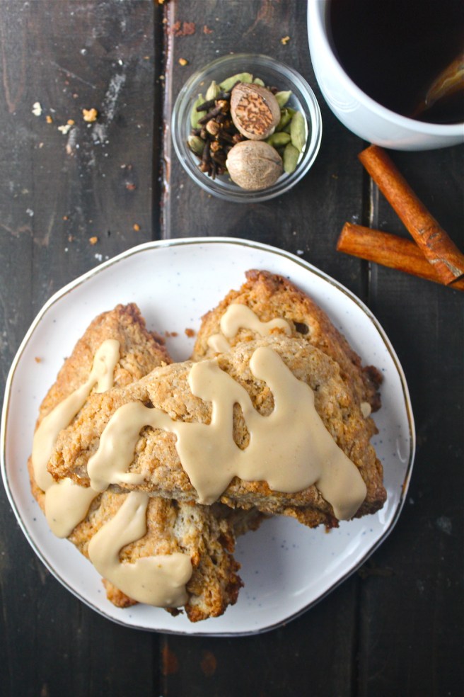 These Chai Spiced Scones are laden with all of my favorite fragrant spices, and topped with a sweet chai glaze! | The Millennial Cook #winterrecipe #breakfast #brunch #scones #chai