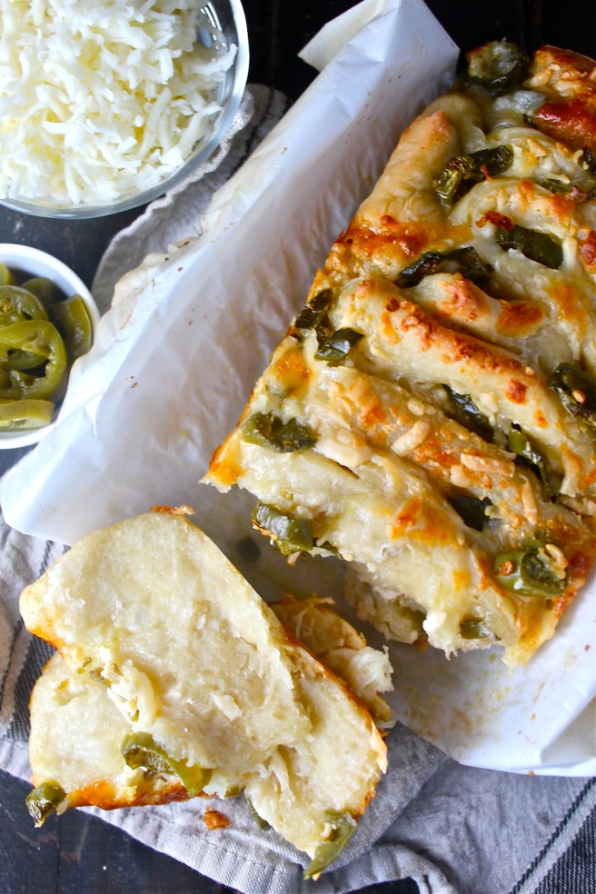 This Cheddar Jalapeno Pull Apart Bread is warm, cheesy, spicy, and so easy to throw together! | The Millennial Cook #cheddar #jalapeno #pullapartbread