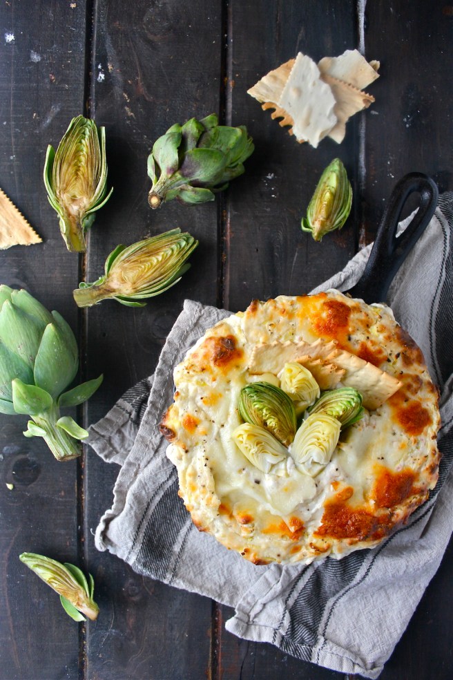 This Creamy Artichoke Dip - with lots of tangy cream cheese, rich mozzarella, and chopped artichokes - is a decadent and delicious party appetizer! | The Millennial Cook #appetizer #artichokedip #artichoke #creamcheese