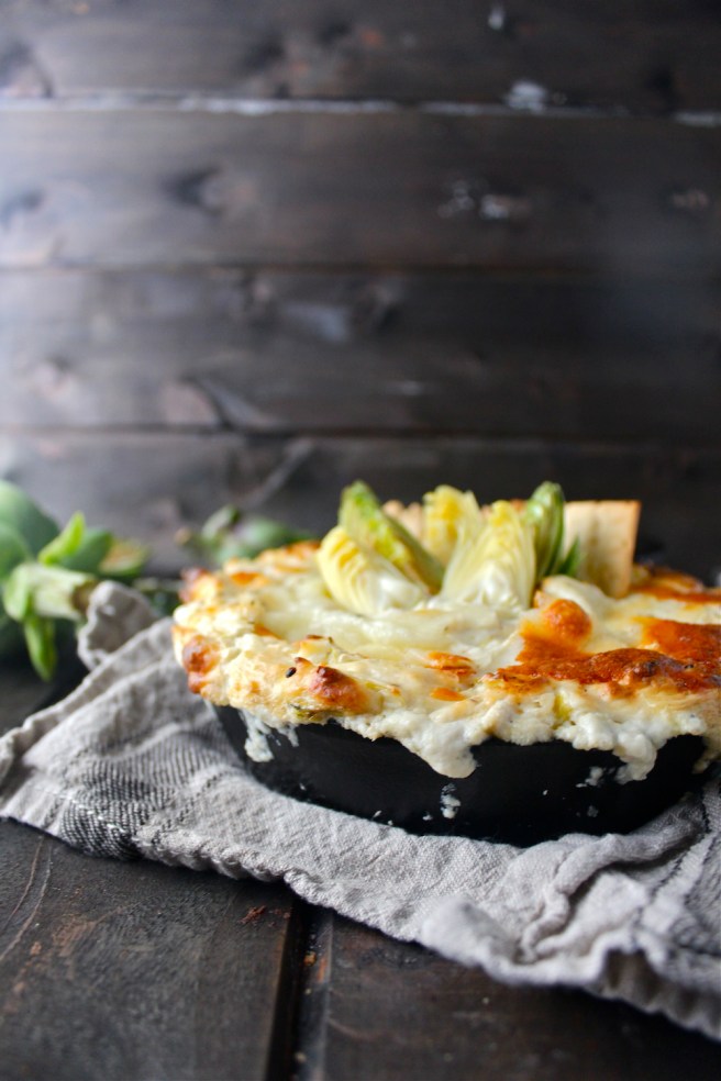 This Creamy Artichoke Dip - with lots of tangy cream cheese, rich mozzarella, and chopped artichokes - is a decadent and delicious party appetizer! | The Millennial Cook #appetizer #artichokedip #artichoke #creamcheese
