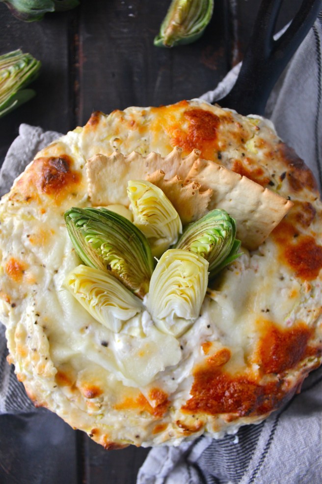 This Creamy Artichoke Dip - with lots of tangy cream cheese, rich mozzarella, and chopped artichokes - is a decadent and delicious party appetizer! | The Millennial Cook #appetizer #artichokedip #artichoke #creamcheese