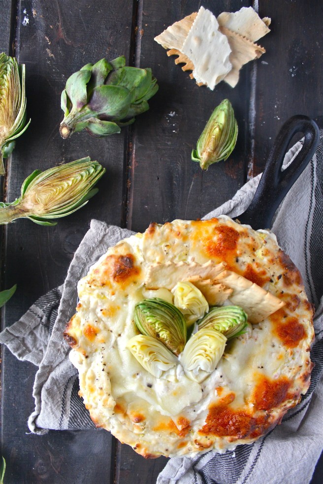 This Creamy Artichoke Dip - with lots of tangy cream cheese, rich mozzarella, and chopped artichokes - is a decadent and delicious party appetizer! | The Millennial Cook #appetizer #artichokedip #artichoke #creamcheese