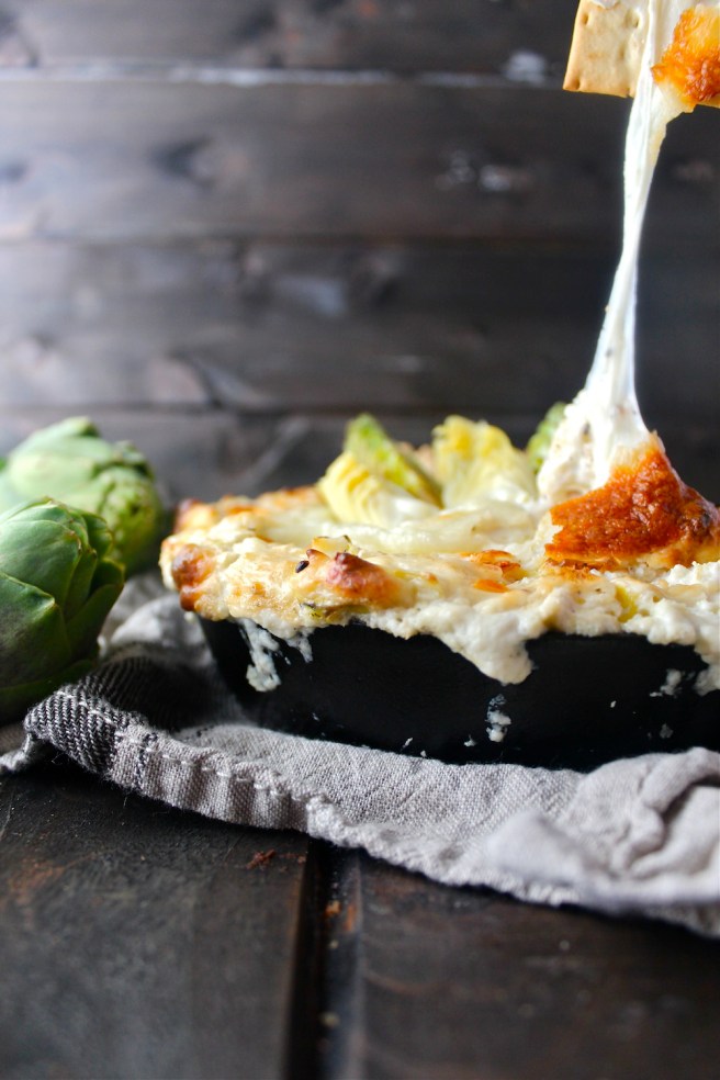 This Creamy Artichoke Dip - with lots of tangy cream cheese, rich mozzarella, and chopped artichokes - is a decadent and delicious party appetizer! | The Millennial Cook #appetizer #artichokedip #artichoke #creamcheese