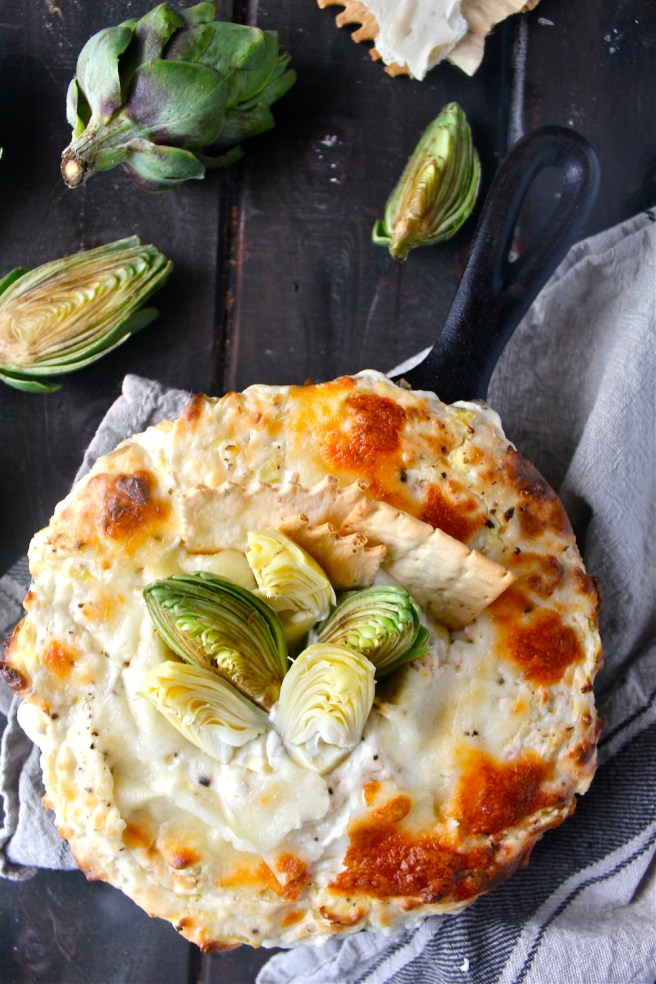 This Creamy Artichoke Dip - with lots of tangy cream cheese, rich mozzarella, and chopped artichokes - is a decadent and delicious party appetizer! | The Millennial Cook #appetizer #artichokedip #artichoke #creamcheese