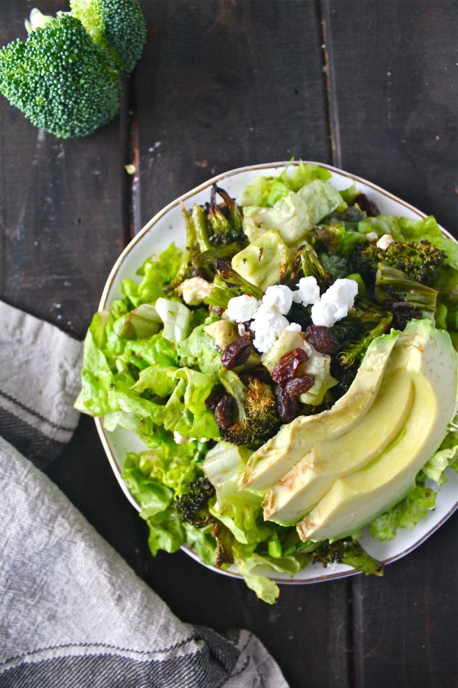 This Lemony Roasted Broccoli Salad with goat cheese, avocado, and sweet raisins is so fresh, wholesome, and hearty! | The Millennial Cook #winterrecipe #salad #broccoli #lemon #garlic #avocado