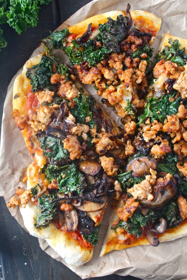 This Sausage & Kale Pizza is topped with the perfect hearty and savory flavors for winter! | The Millennial Cook #winterrecipe #pizza #sausage #kale