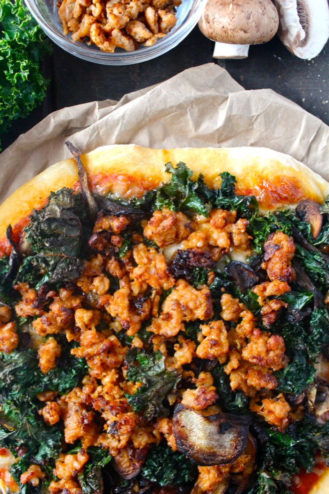 This Sausage & Kale Pizza is topped with the perfect hearty and savory flavors for winter! | The Millennial Cook #winterrecipe #pizza #sausage #kale