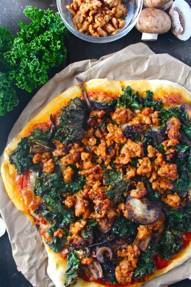 This Sausage & Kale Pizza is topped with the perfect hearty and savory flavors for winter! | The Millennial Cook #winterrecipe #pizza #sausage #kale