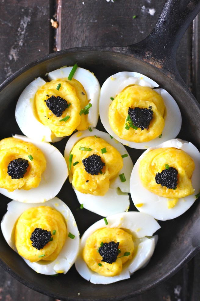 These Fancy Deviled Eggs - with fragrant truffle oil and caviar - are a simple yet decadent treat! | The Millennial Cook #eggs #deviledeggs #truffle #caviar