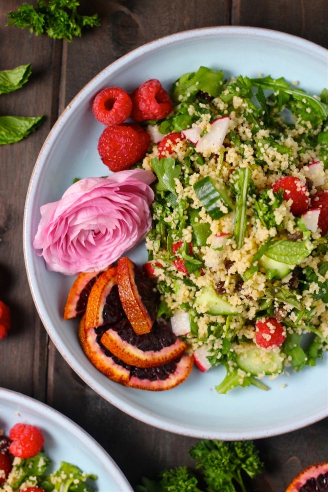This flavorful Spring Couscous Salad is filled with peppery arugula, fresh raspberries, and crunchy vegetables! | The Millennial Cook #spring #springrecipe #salad #couscous
