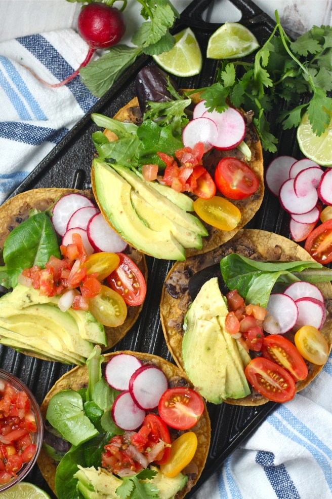 These Vegan Black Bean Tostadas are an easy homemade dinner to satisfy any Mexican craving! | The Millennial Cook #mexican #tostada #avocado #vegetarian #vegan